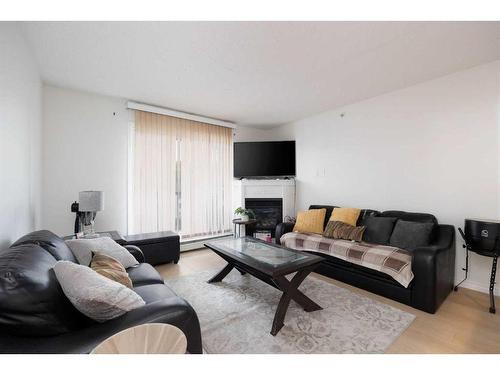 541-200 Richard Street, Fort Mcmurray, AB - Indoor Photo Showing Living Room With Fireplace