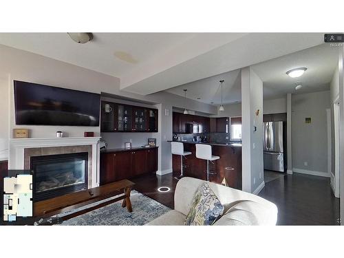 8-313 Millennium Drive, Fort Mcmurray, AB - Indoor Photo Showing Living Room With Fireplace