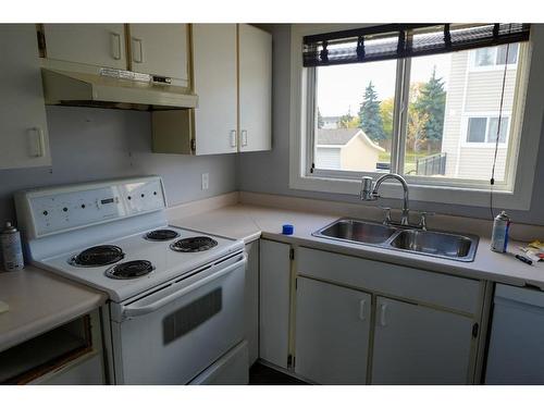 525-600 Signal Road, Fort Mcmurray, AB - Indoor Photo Showing Kitchen With Double Sink