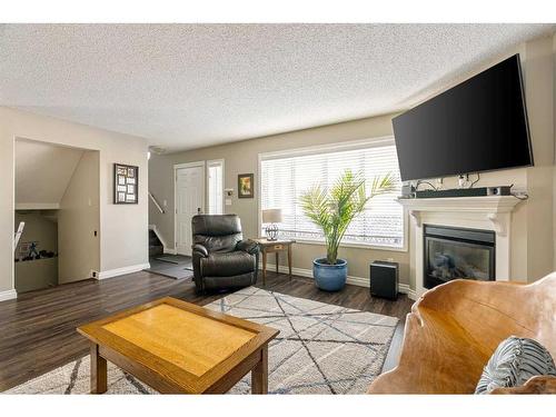 232 Sitka Drive, Fort Mcmurray, AB - Indoor Photo Showing Living Room With Fireplace