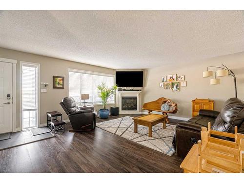 232 Sitka Drive, Fort Mcmurray, AB - Indoor Photo Showing Living Room With Fireplace