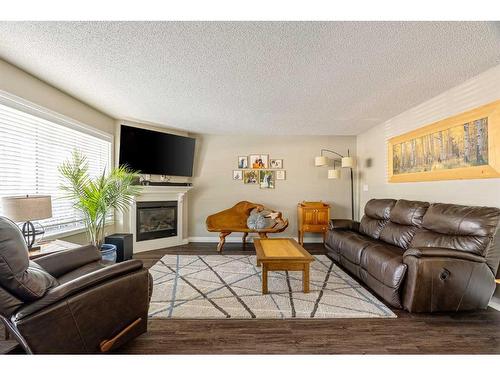 232 Sitka Drive, Fort Mcmurray, AB - Indoor Photo Showing Living Room With Fireplace