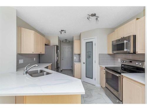 129 Cinnamon Street, Fort Mcmurray, AB - Indoor Photo Showing Kitchen With Stainless Steel Kitchen With Double Sink