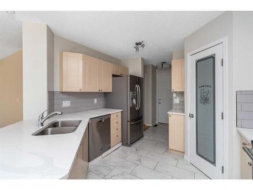 129 Cinnamon Street, Fort Mcmurray, AB - Indoor Photo Showing Kitchen With Stainless Steel Kitchen With Double Sink