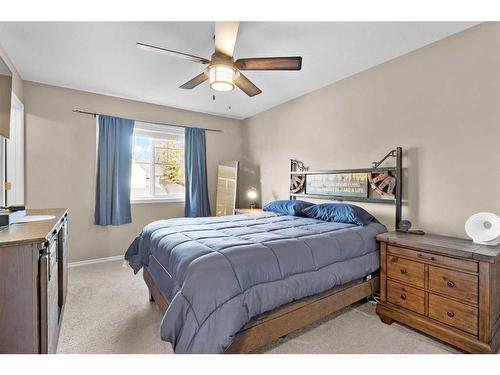 54 Mackenzie Way, Carstairs, AB - Indoor Photo Showing Bedroom