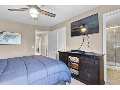 54 Mackenzie Way, Carstairs, AB - Indoor Photo Showing Bedroom