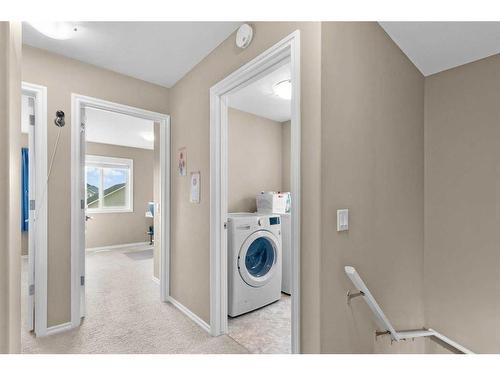 54 Mackenzie Way, Carstairs, AB - Indoor Photo Showing Laundry Room