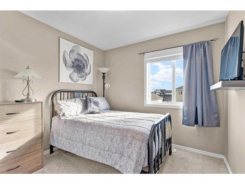 54 Mackenzie Way, Carstairs, AB - Indoor Photo Showing Bedroom