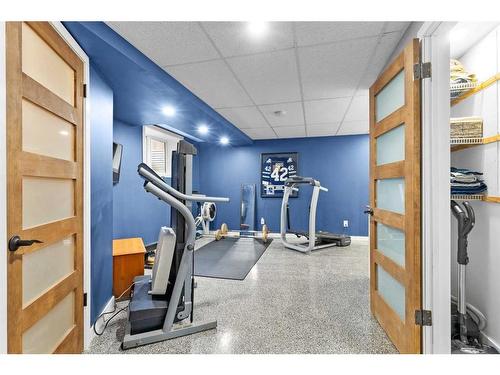 54 Mackenzie Way, Carstairs, AB - Indoor Photo Showing Gym Room