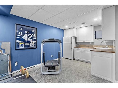 54 Mackenzie Way, Carstairs, AB - Indoor Photo Showing Kitchen