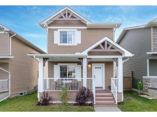 54 Mackenzie Way, Carstairs, AB - Outdoor With Deck Patio Veranda With Facade