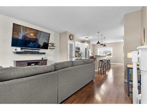 54 Mackenzie Way, Carstairs, AB - Indoor Photo Showing Living Room