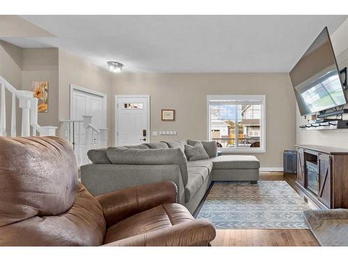 54 Mackenzie Way, Carstairs, AB - Indoor Photo Showing Living Room