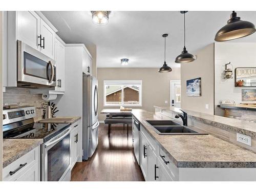 54 Mackenzie Way, Carstairs, AB - Indoor Photo Showing Kitchen With Stainless Steel Kitchen With Double Sink With Upgraded Kitchen