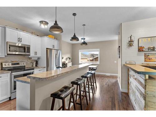 54 Mackenzie Way, Carstairs, AB - Indoor Photo Showing Kitchen With Stainless Steel Kitchen With Upgraded Kitchen