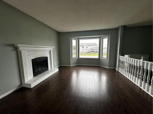 117 Bacon Place, Fort Mcmurray, AB - Indoor Photo Showing Living Room With Fireplace