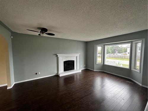 117 Bacon Place, Fort Mcmurray, AB - Indoor Photo Showing Living Room With Fireplace