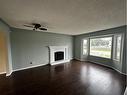 117 Bacon Place, Fort Mcmurray, AB  - Indoor Photo Showing Living Room With Fireplace 