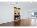 122 Leigh Crescent, Fort Mcmurray, AB  - Indoor Photo Showing Living Room With Fireplace 