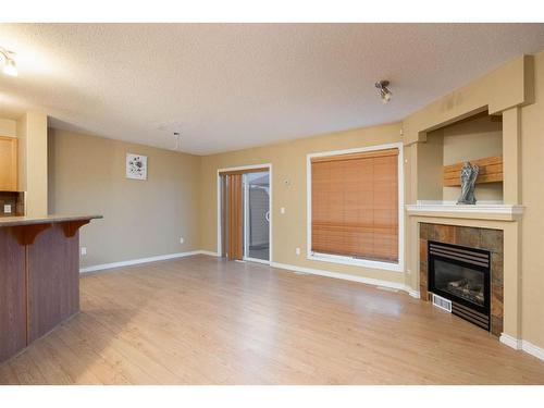 101 Sandstone Lane, Fort Mcmurray, AB - Indoor Photo Showing Living Room With Fireplace