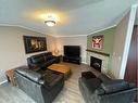 304 Ash Way, Fort Mcmurray, AB  - Indoor Photo Showing Living Room With Fireplace 