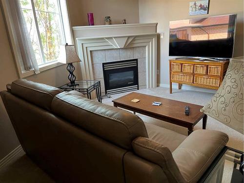 105-1095 Timberline Drive East, Fort Mcmurray, AB - Indoor Photo Showing Living Room With Fireplace