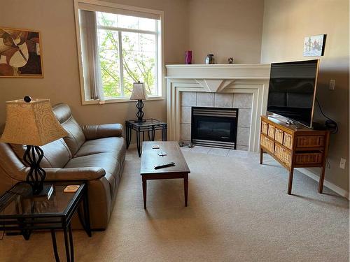 105-1095 Timberline Drive East, Fort Mcmurray, AB - Indoor Photo Showing Living Room With Fireplace