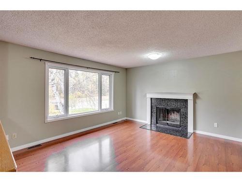 339 Cornwall Drive, Fort Mcmurray, AB - Indoor Photo Showing Living Room With Fireplace