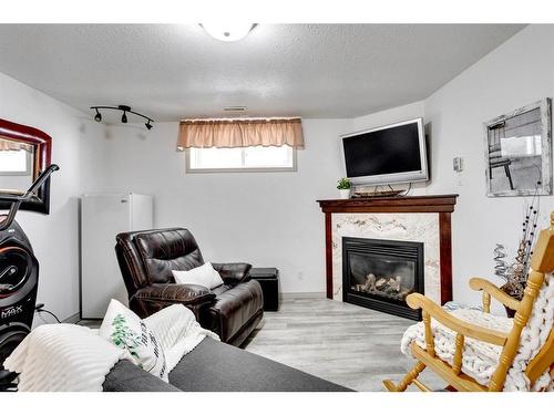 156 Archibald Close, Fort Mcmurray, AB - Indoor Photo Showing Living Room With Fireplace