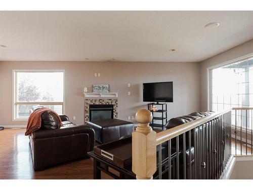 136 Pinnacle Place, Fort Mcmurray, AB - Indoor Photo Showing Living Room With Fireplace