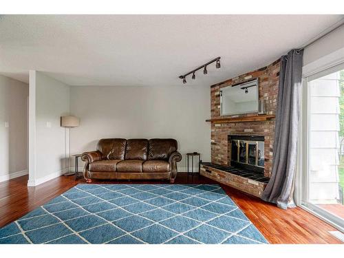 124 Marten Place, Fort Mcmurray, AB - Indoor Photo Showing Living Room With Fireplace