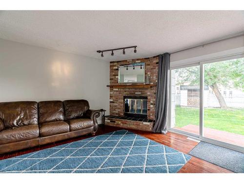 124 Marten Place, Fort Mcmurray, AB - Indoor Photo Showing Living Room With Fireplace