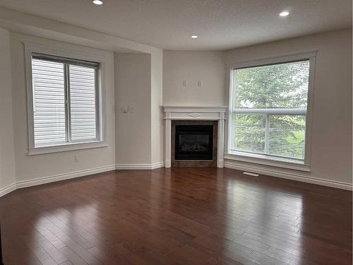 22-193 O'Coffey Crescent, Fort Mcmurray, AB - Indoor Photo Showing Living Room With Fireplace