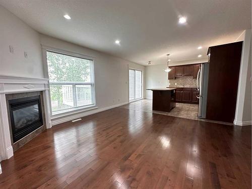 22-193 O'Coffey Crescent, Fort Mcmurray, AB - Indoor Photo Showing Living Room With Fireplace