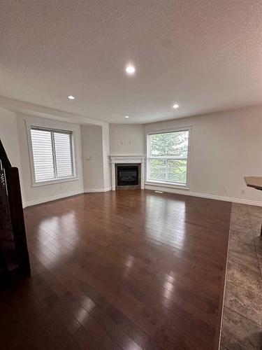 22-193 O'Coffey Crescent, Fort Mcmurray, AB - Indoor Photo Showing Other Room With Fireplace