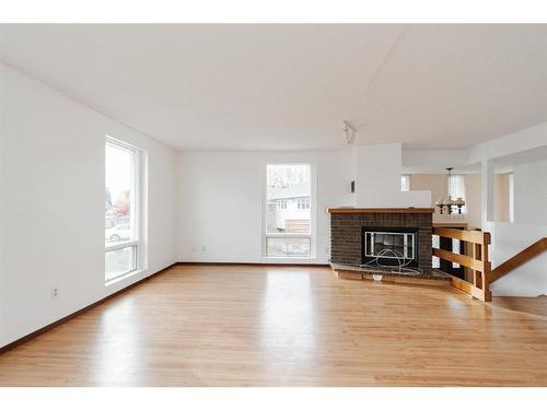 332 Ermine Crescent, Fort Mcmurray, AB - Indoor Photo Showing Living Room With Fireplace