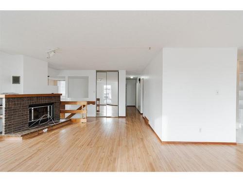 332 Ermine Crescent, Fort Mcmurray, AB - Indoor Photo Showing Living Room With Fireplace