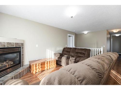 117 Sandulac Street, Fort Mcmurray, AB - Indoor Photo Showing Living Room With Fireplace