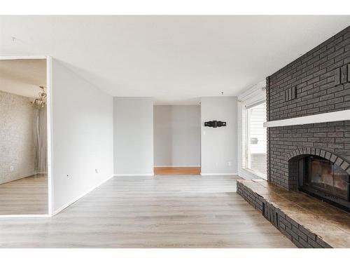 163 Cornwall Drive, Fort Mcmurray, AB - Indoor Photo Showing Living Room With Fireplace