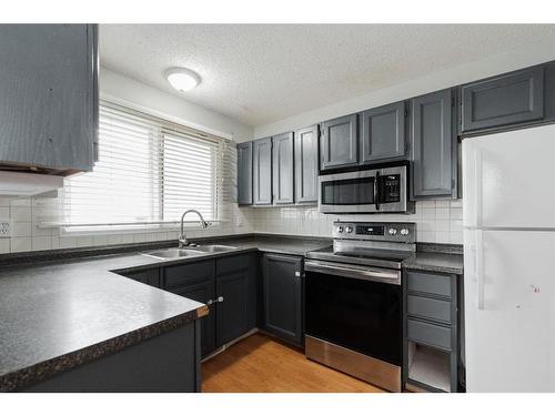 163 Cornwall Drive, Fort Mcmurray, AB - Indoor Photo Showing Kitchen With Double Sink