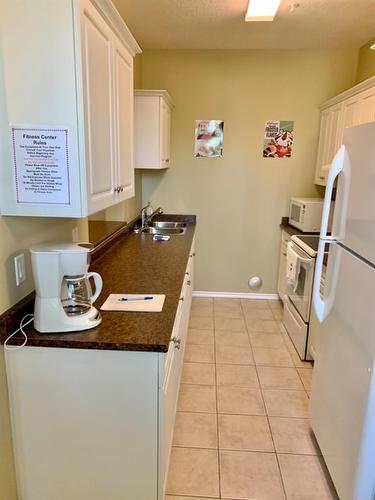 410-10212 101 Street, Lac La Biche, AB - Indoor Photo Showing Kitchen With Double Sink