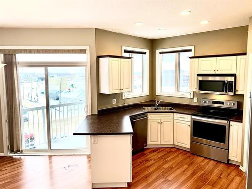 410-10212 101 Street, Lac La Biche, AB - Indoor Photo Showing Kitchen With Double Sink