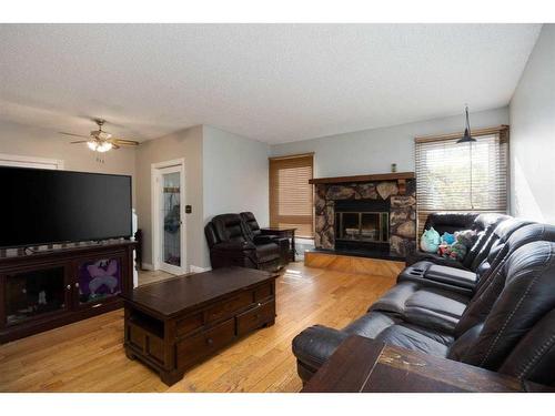 189 Oaks Bay, Fort Mcmurray, AB - Indoor Photo Showing Living Room With Fireplace