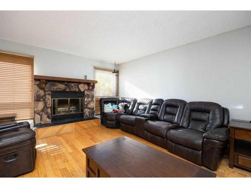 189 Oaks Bay, Fort Mcmurray, AB - Indoor Photo Showing Living Room With Fireplace