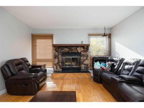 189 Oaks Bay, Fort Mcmurray, AB - Indoor Photo Showing Living Room With Fireplace