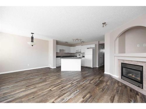 231 Bear Paw Drive, Fort Mcmurray, AB - Indoor Photo Showing Living Room With Fireplace