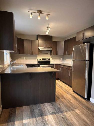 42-401 Athabasca Avenue, Fort Mcmurray, AB - Indoor Photo Showing Kitchen With Stainless Steel Kitchen With Double Sink