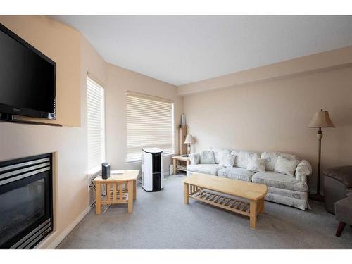 305-123 Arabian Drive, Fort Mcmurray, AB - Indoor Photo Showing Living Room With Fireplace