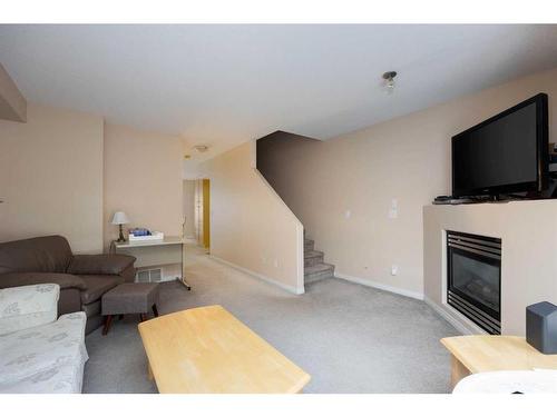 305-123 Arabian Drive, Fort Mcmurray, AB - Indoor Photo Showing Living Room With Fireplace