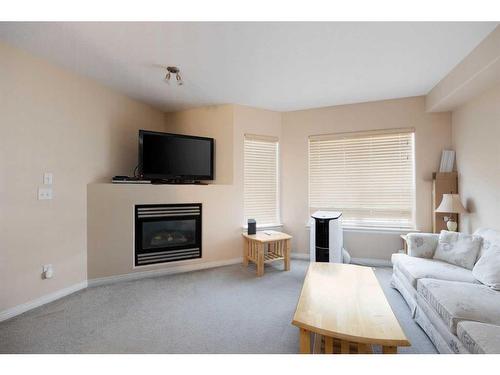 305-123 Arabian Drive, Fort Mcmurray, AB - Indoor Photo Showing Living Room With Fireplace